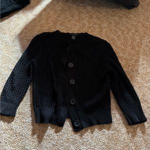 Black sweater fits like a small
